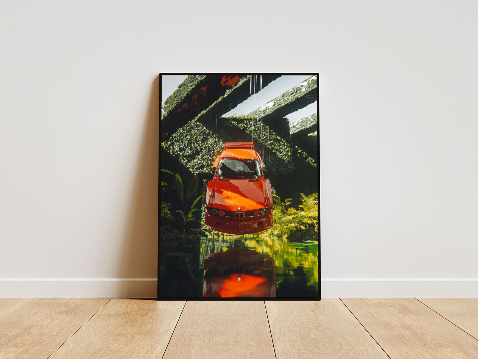 Close-up Poster mit Rahmen vom BMW Auto in verscheidenen Winkeln welches in der Luft schwebt über wasser und mit Natur grün im Hintergrund oranger BMW weiß grün orange